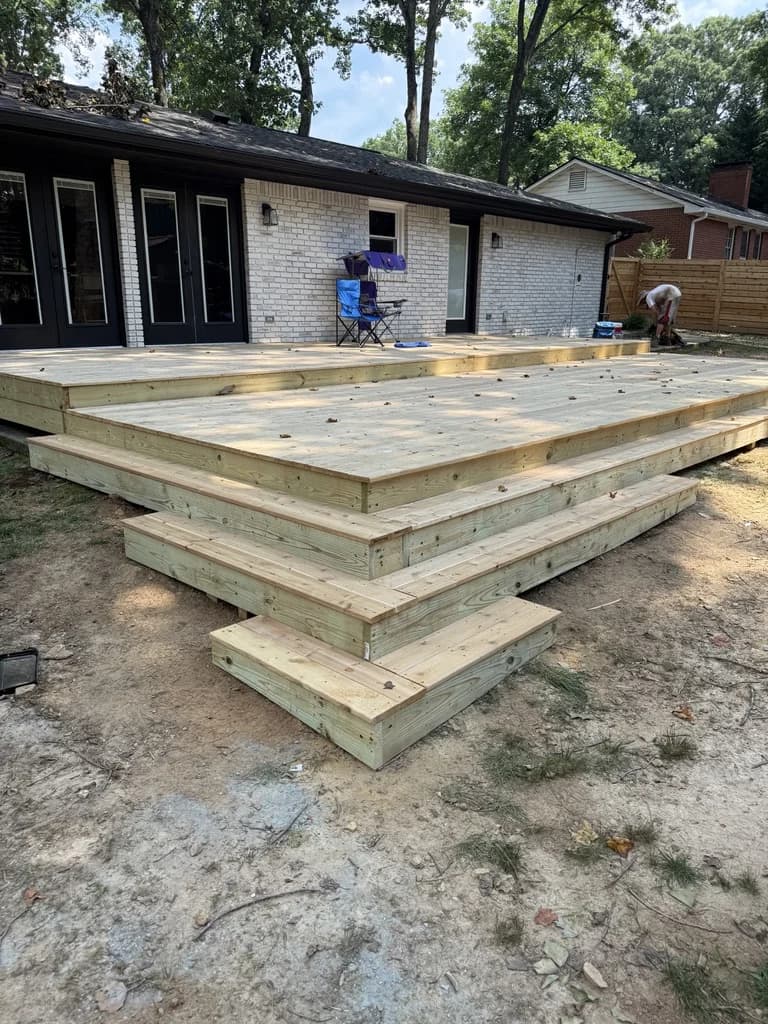 Multi-Level Cedar Ground Deck with Cascading Waterfall Steps