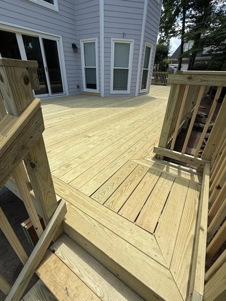 Large multi-level composite deck with outdoor living space in Roswell GA by RBJ Contracting